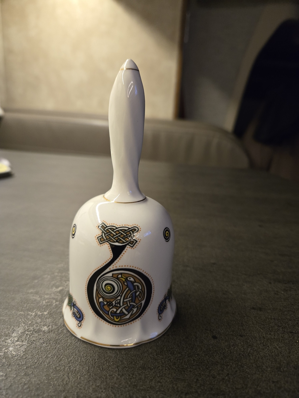 White Ceramic Decorative Bell with Gold and Black Celtic Motifs